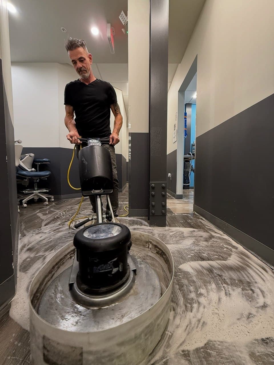 CT Cleaning's owner burnishing a commercial floor